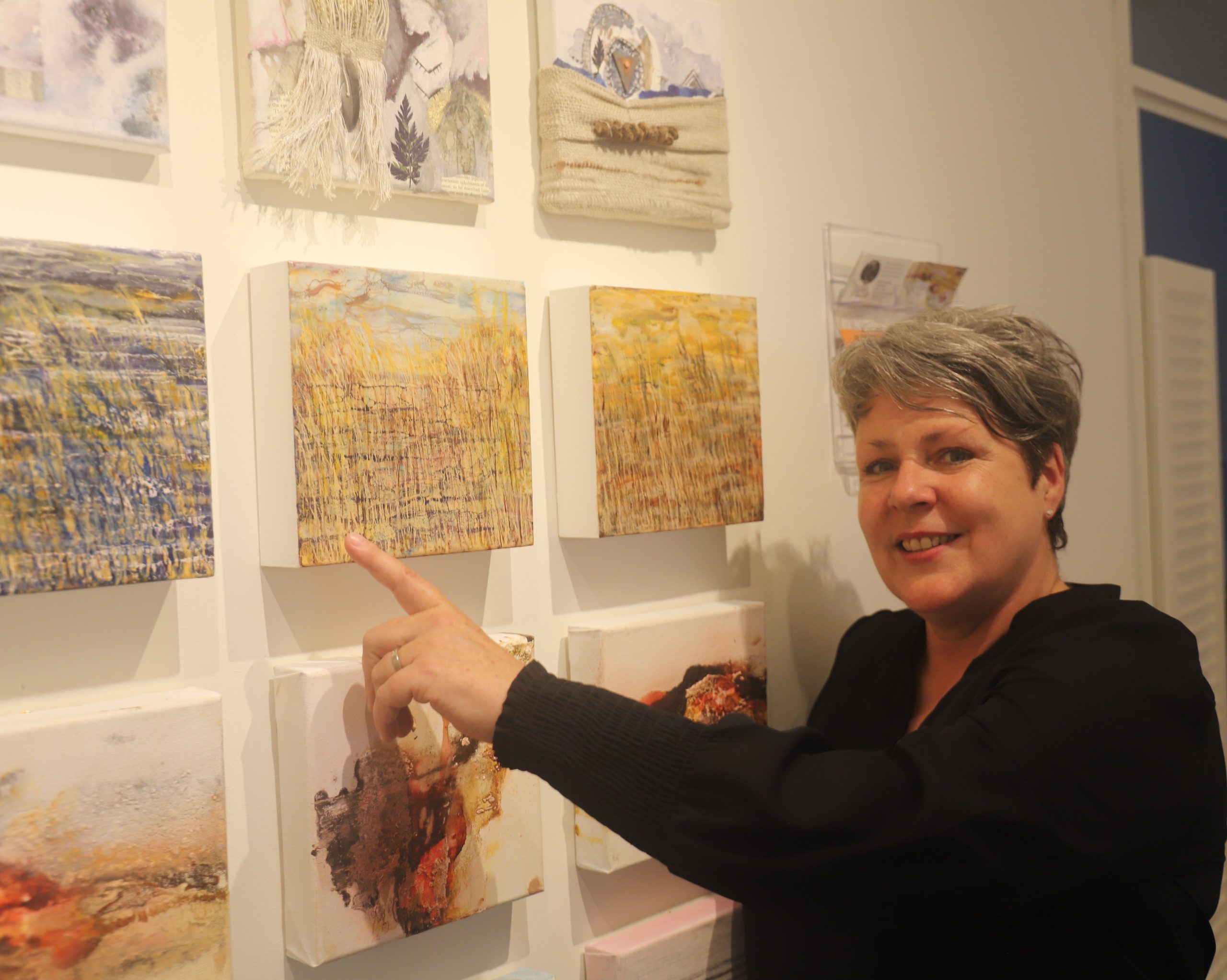 Interior of a small art gallery with wooden floors